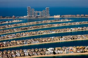 Dubai luxury real estate boom in 2025 with $116M villa sale and millionaire migration, Jarsmak Property Management branding.